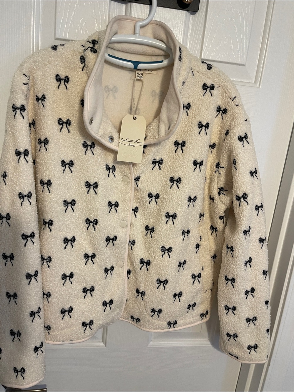 Ivory Sherpa Puffer Jacket with Black Bow Print - Lulus